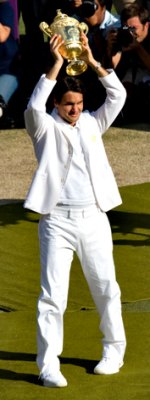 Roger Federer holds his Wimbledon trophy