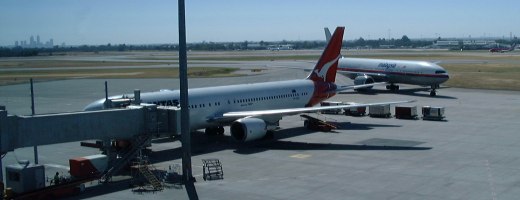 [Qantas and Malaysia Airlines planes at Perth Airport]